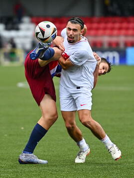 Eivind Helland of Norway in action against Berkay Yilmaz of