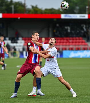 Eivind Helland of Norway in action against Berkay Yilmaz of