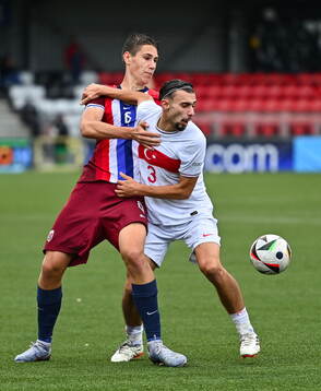 Eivind Helland of Norway in action against Berkay Yilmaz of