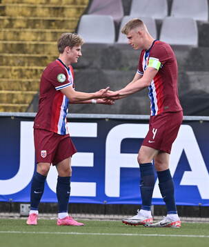 Simen Vatne Haram, right, celebrates with Norway teammate