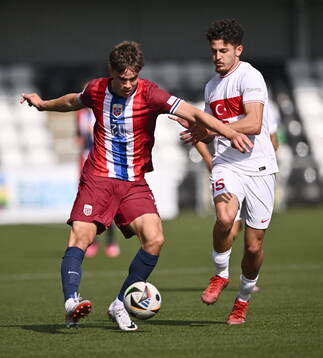 Daniel Braut of Norway in action against Emirhan Basyigit