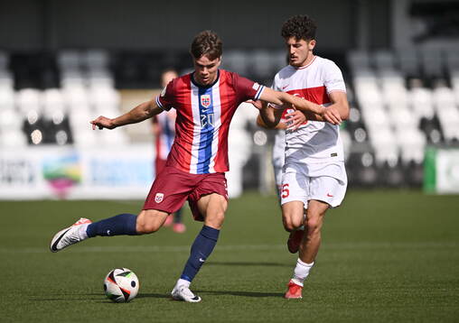Daniel Braut of Norway in action against Emirhan Basyigit