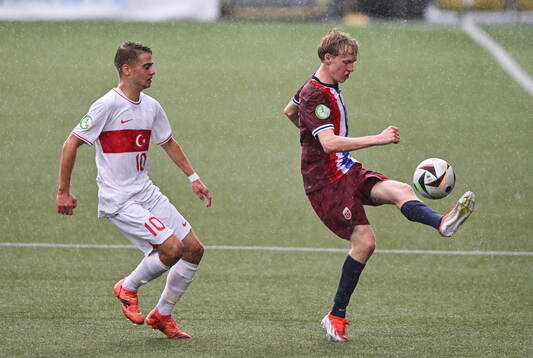 Sondre Granaas of Norway in action against Emir Bars of