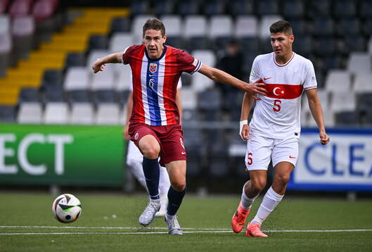 Eivind Helland of Norway in action against Efe Sarikaya of