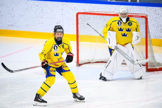 Axel Elofsson and goaltender Axel Göransson of Sweden