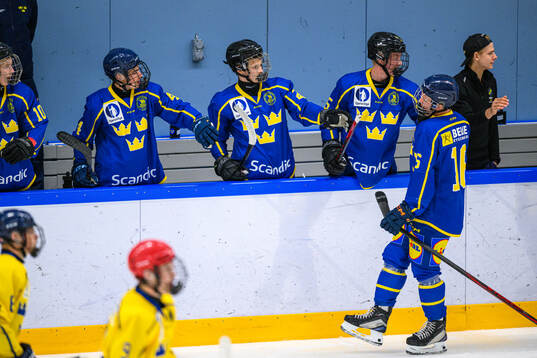 Olle Ågren of Sweden celebrates with teammates