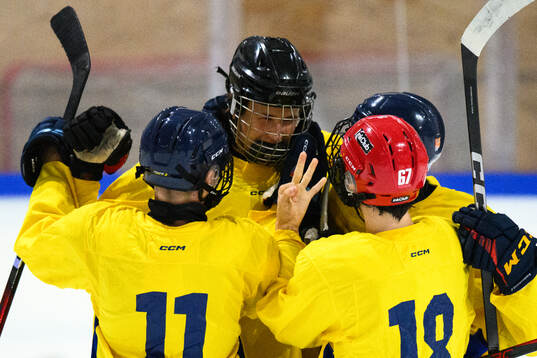 Jakob Ihs Wozniak of Sweden celebrates with teammates