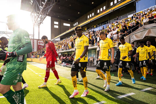 The teams enter the field