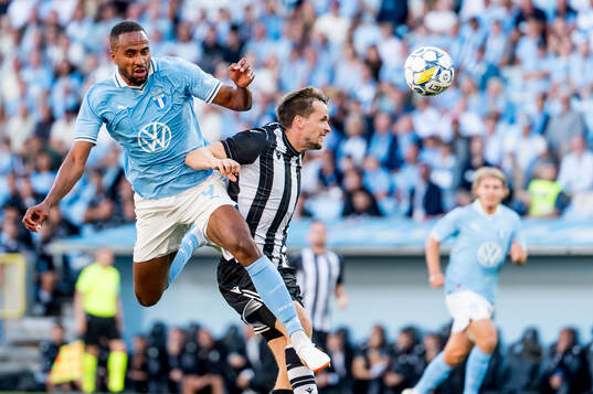 Isaac Kiese Thelin of Malmö FF and Tomasz Kedziora of PAOK