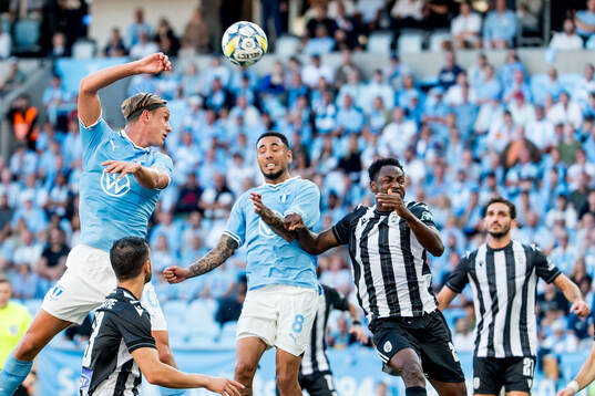 Erik Botheim and Sergio Pena of Malmö FF and Abdul Rahman