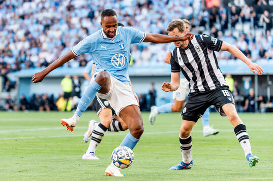 Isaac Kiese Thelin of Malmö FF and Tomasz Kedziora of PAOK
