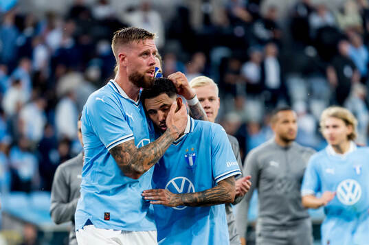 Pontus Jansson and Sergio Pena of Malmö FF look dejected