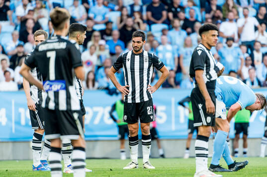 The players of PAOK looks dejected