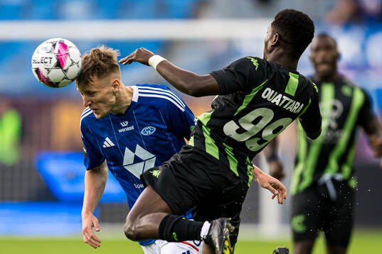 Valdemar Lund Jensen of Molde and Faso Abdoul Kader