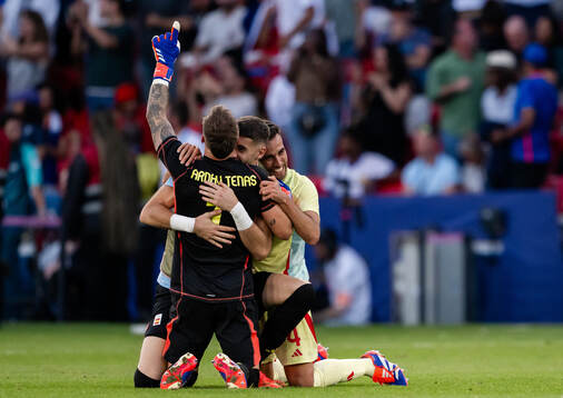 Goalkeeper Arnau Tenas and Eric Garcia of Spain celebrate