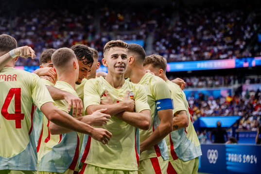 Fermin Lopez of Spain celebrates with teammates