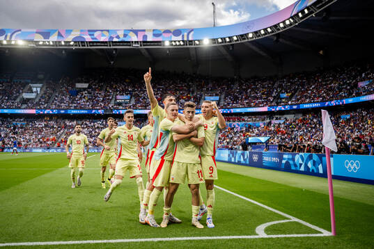 Fermin Lopez of Spain celebrates with teammates