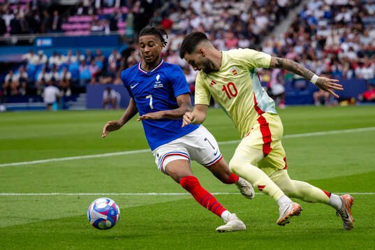 Maghnes Akliouche of France and Alex Baena of Spain in the