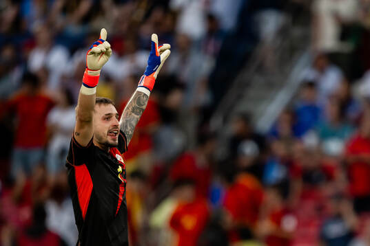 Goalkeeper Arnau Tenas of Spain celebrates