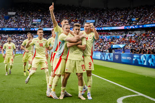 Fermin Lopez of Spain celebrates with teammates
