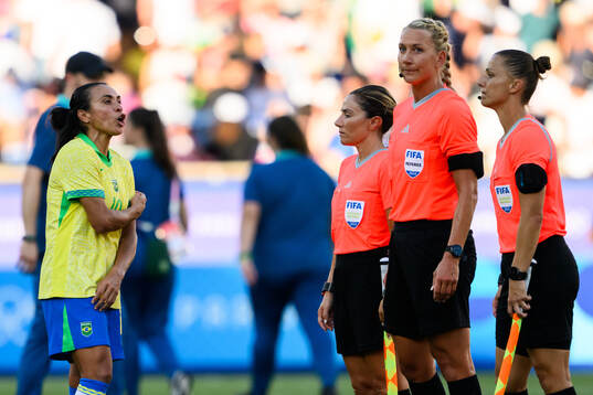 Marta of Brazil reacts against referee Francesca di Monte,