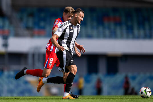 Alexander Sørloth of Atletico Madrid and Federico Gatti of