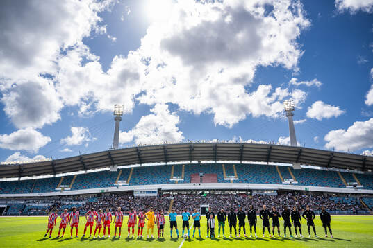 Players of Atletico Madrid and of Juventus line up