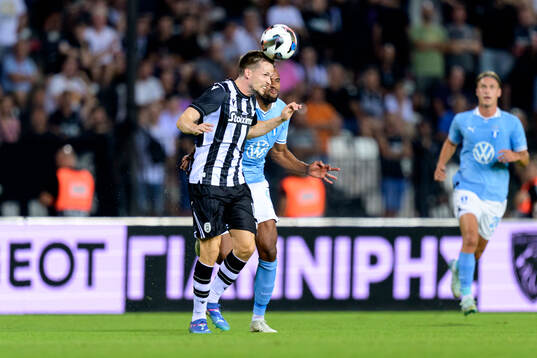 Tomasz Kedziora of PAOK and Isaac Kiese Thelin of Malmö FF