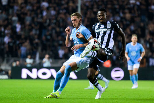 Søren Rieks of Malmö FF and Abdul Rahman Baba of PAOK
