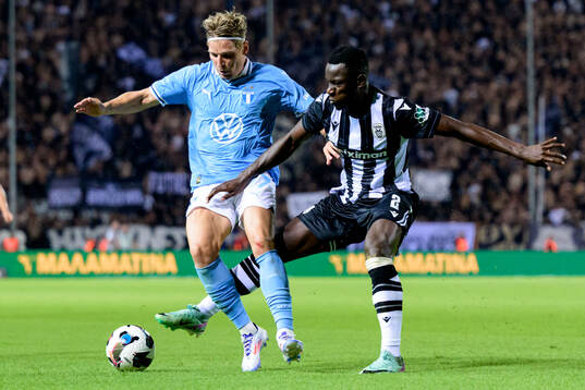 Jens Stryger Larsen of Malmö FF and Mady Camara of PAOK