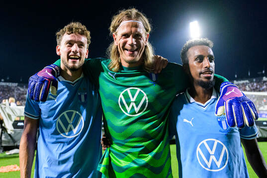 Goalkeeper Johan Dahlin and Taha Ali of Malmö FF celebrate