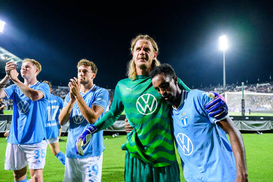 Goalkeeper Johan Dahlin and Taha Ali of Malmö FF celebrate