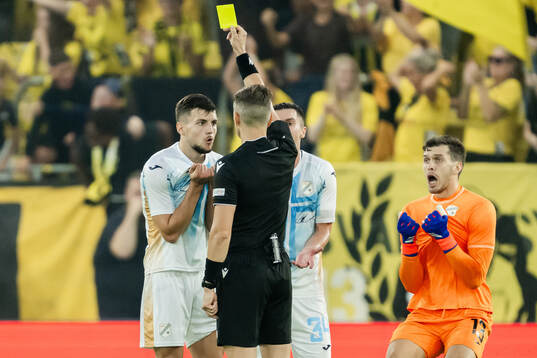 Niko Galesic of Rijeka receives a yellow card