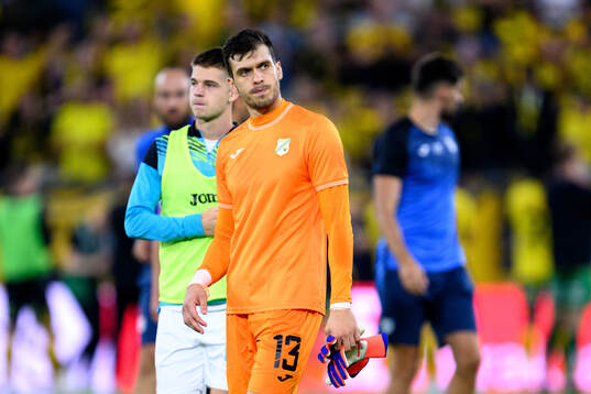 Goalkeeper Martin Zlomislic of Rijeka looks dejected