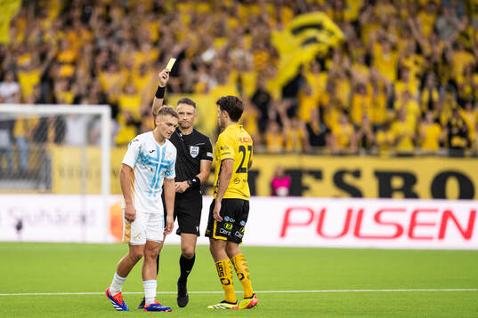 Toni Fruk of Rijeka is shown a yellow card by referee