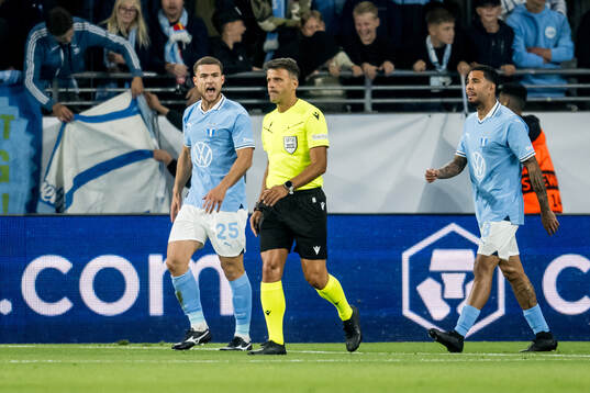 Gabriel Busanello of Malmö FF and referee Jesús Gil