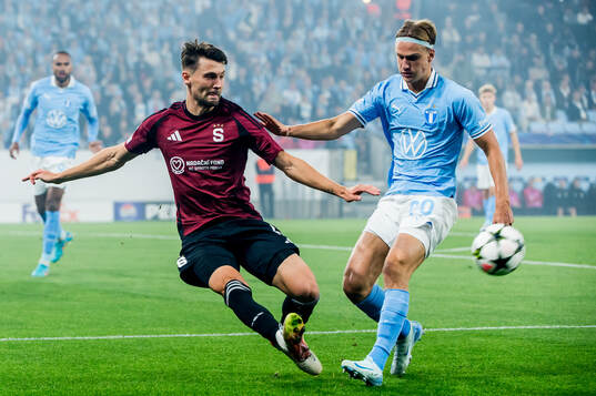 Kaan Kairinen of Sparta Prag and Erik Botheim of Malmö FF
