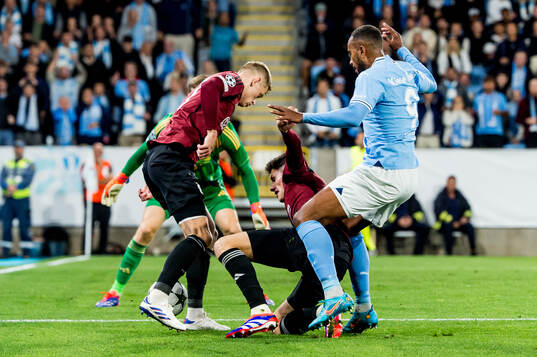 Filip Panak and Martin Vitik of Sparta Prag against Isaac