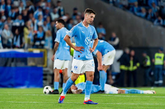 Lasse Berg Johnsen of Malmö FF looks dejected