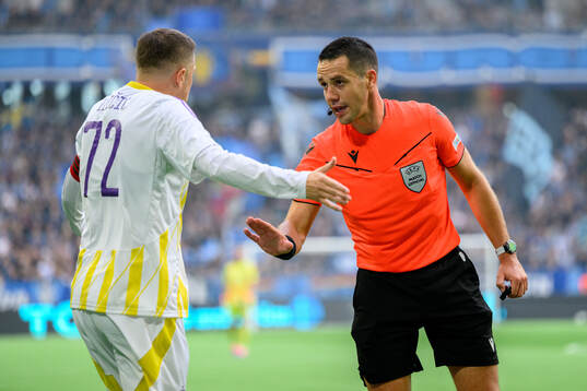 Josip Ilicic of Maribor talks to referee Jasper Vergoote