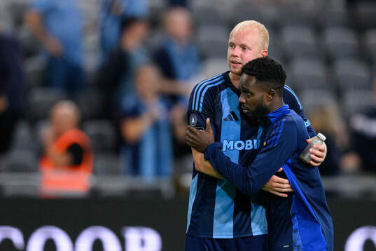 Peter Therkildsen and Tokmac Nguen celebrate