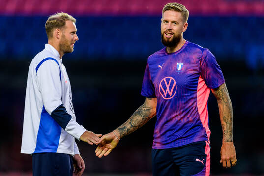Assistant coach Ola Toivonen and Pontus Jansson of Malmö FF
