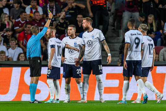 Pontus Jansson of Malmö FF is shown a yellow card