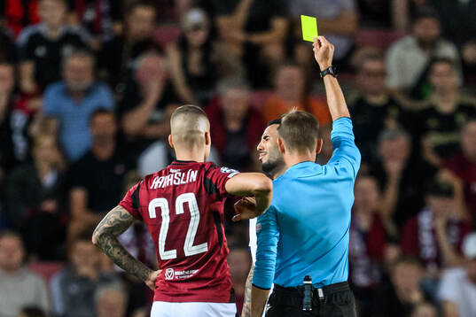 Sergio Pena of Malmö FF is shown a yellow card