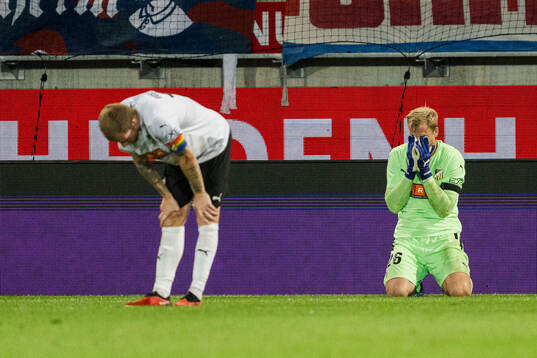 Simon Gustafson and goalkeeper Peter Abrahamsson of Häcken