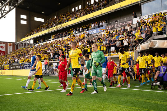 The teams enters the arena