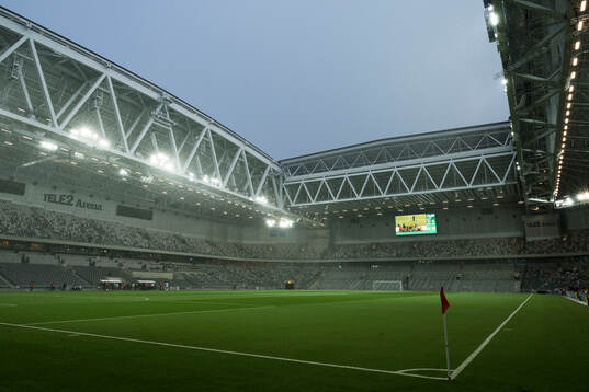 Vy över Tele2 Arena i regnoväder