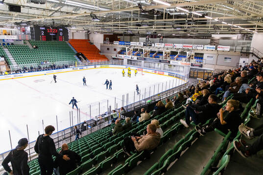 Spectators following the play