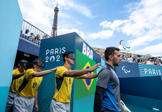 Members of the Brazil team are led onto the pitch