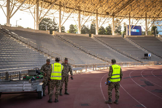 Members of the military inside of Tofiq Bahramov